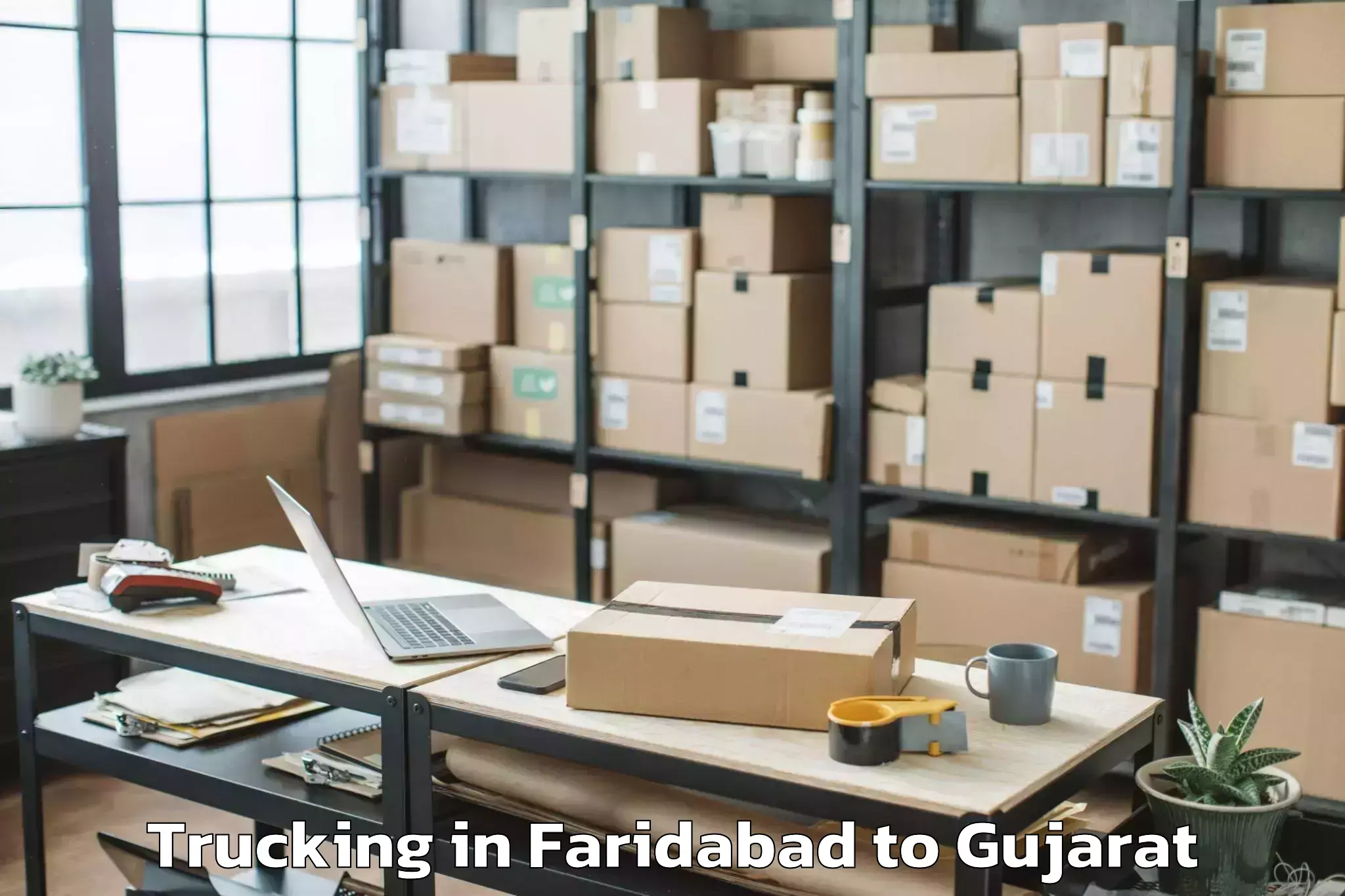 Book Faridabad to Veer Narmad South Gujarat Univ Trucking